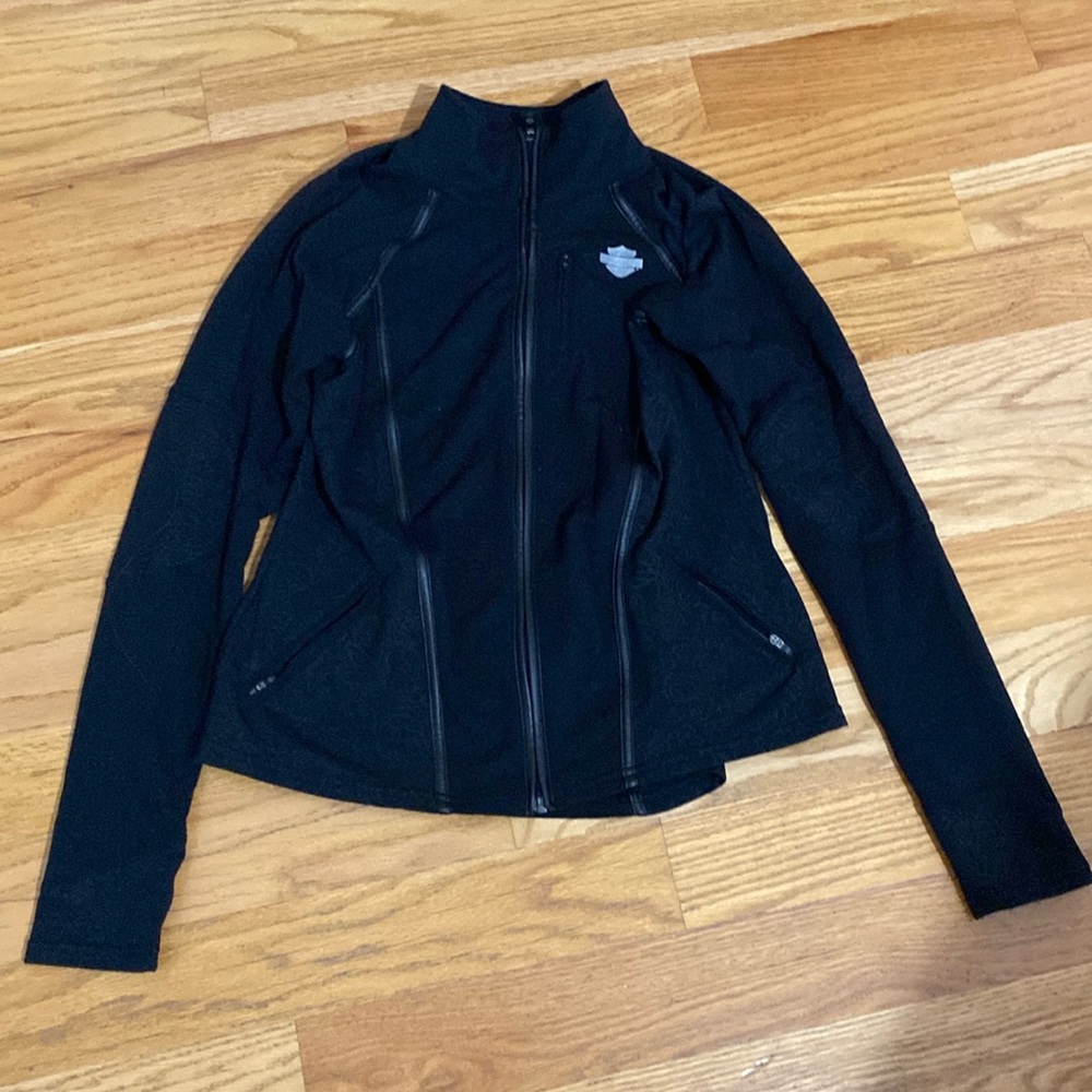 Woman’s Harley Davidson size small light jacket with thumb holes color black